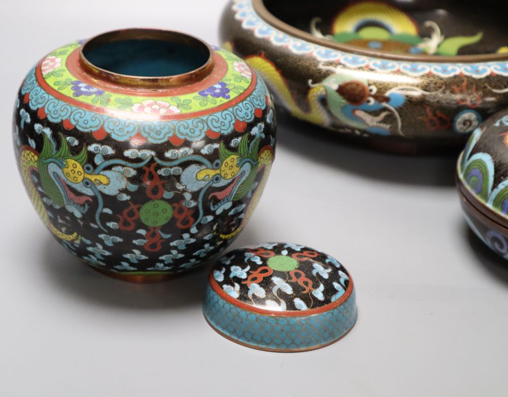 An early 20th century Chinese cloisonne enamel dragon bowl, a similar box and cover and a ginger jar and cover, largest diameter 30cm